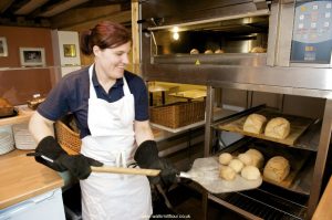 Removing Fresh Bread from the Oven